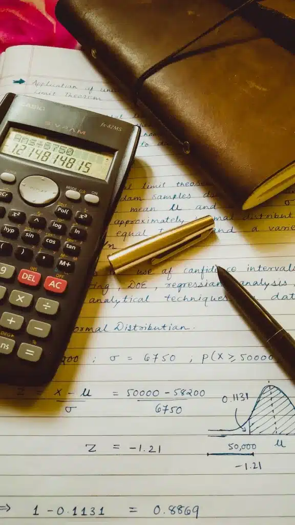 A calculator and a list of expenses related to property investment